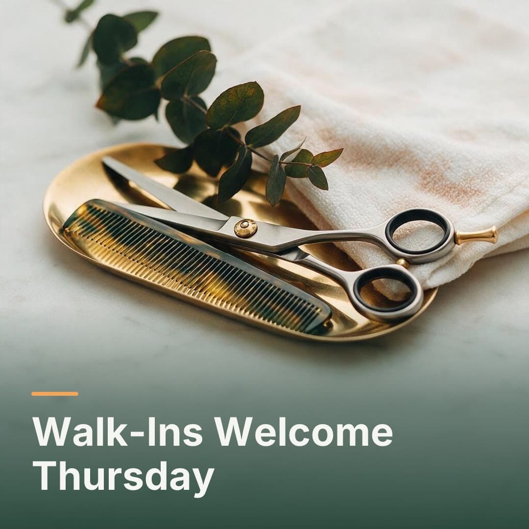 Shears and a folded towel on a marble counter